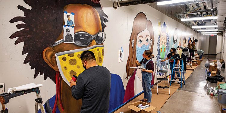 Art imitates life: UTA principals create a mural to depict the times